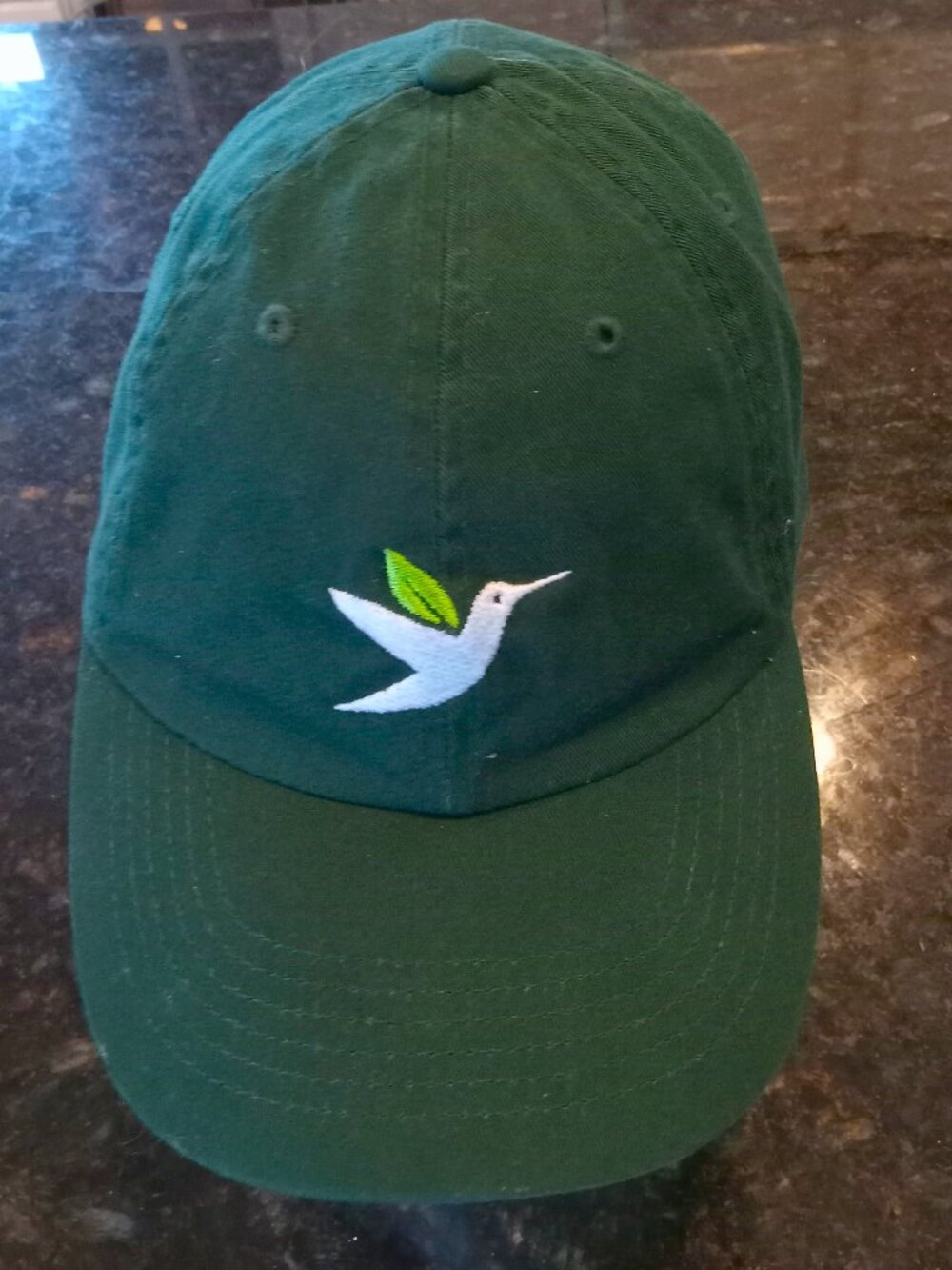 100% Cotton Bird Conservancy Bill Cap w/Emroidered Hummingbird on Dk Green Body